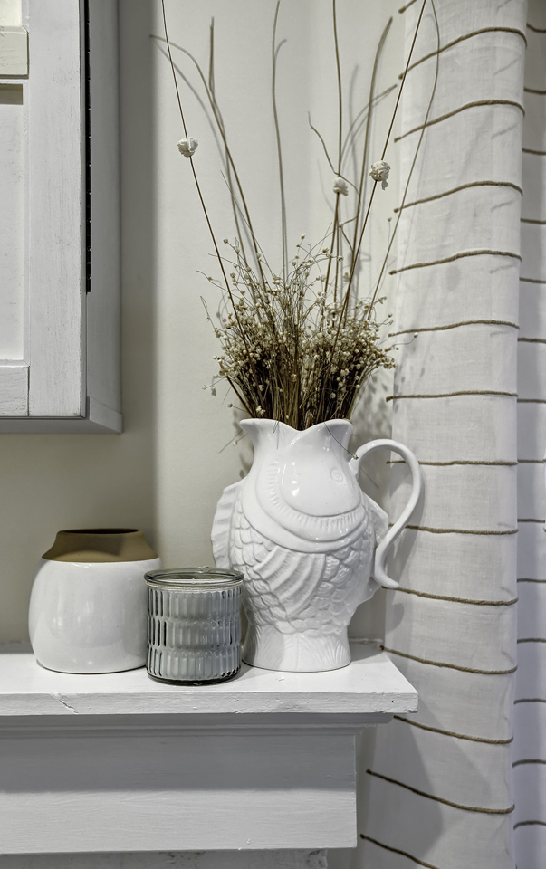White Fish Vase and Decor on White Fireplace Mantel A Space to Call Home